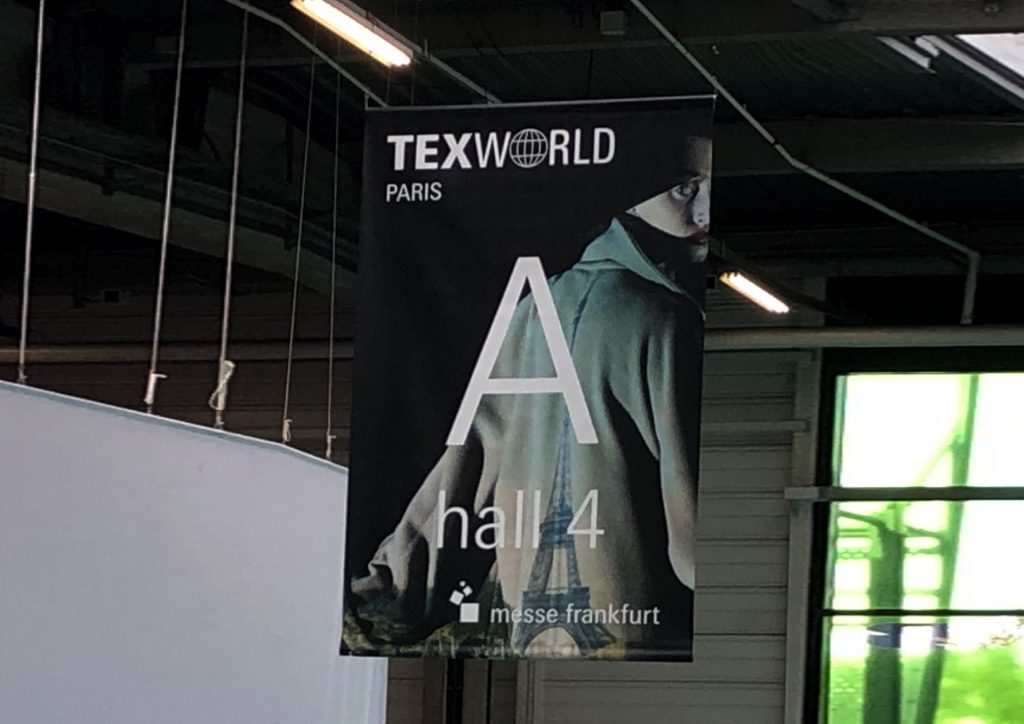 A poster hanging in a hall of Texworld, a clothing manufacturer fair held twice a year in Paris, France.