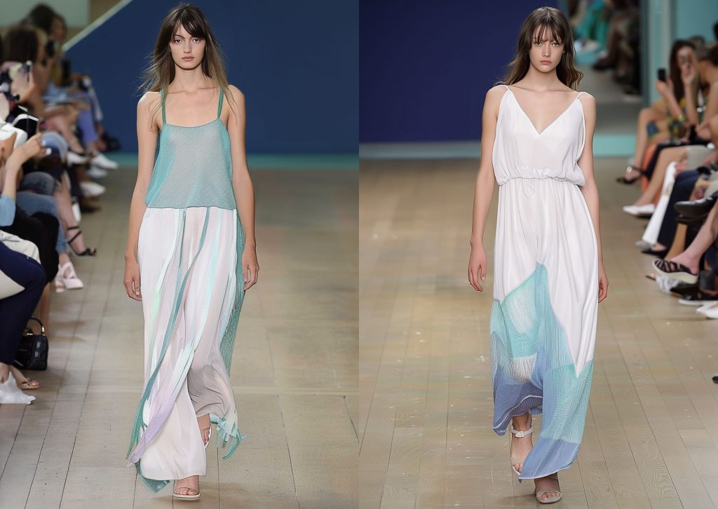 Two women walk on a catwalk wearing white and turquoise summer looks in lightweight knits